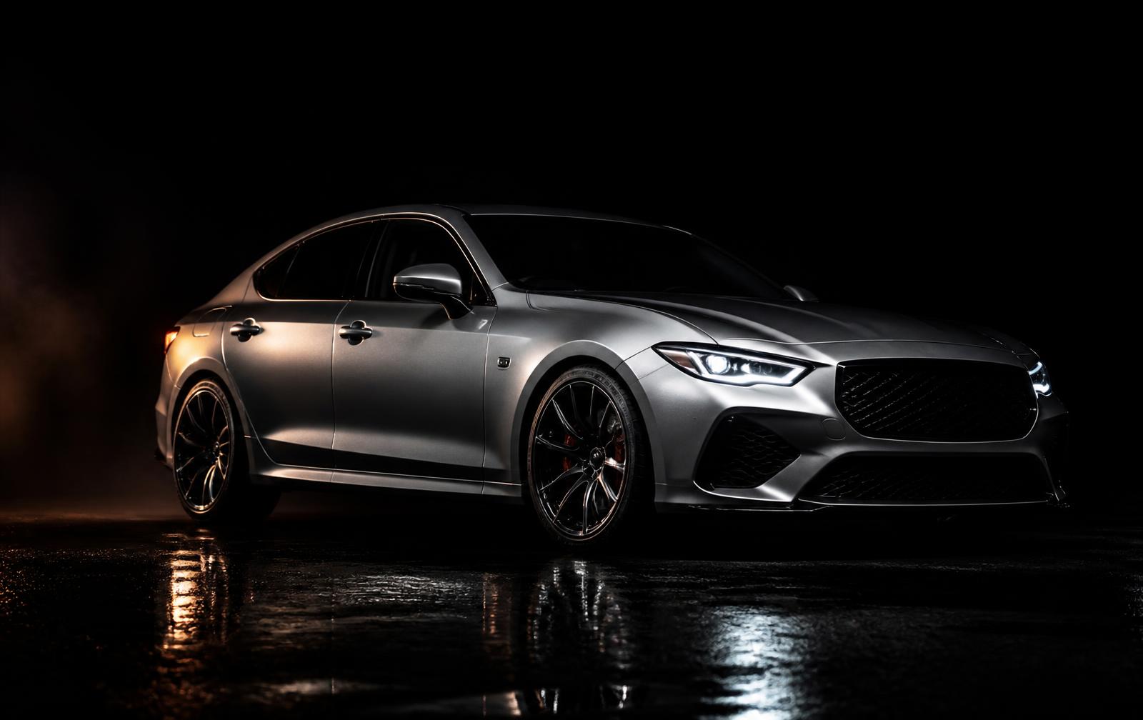Silver performance sedan under night lighting